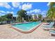 Refreshing community pool with lounge chairs at 5980 Terrace Park N Dr # 105, St Petersburg, FL 33709