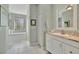 Bright bathroom featuring a soaking tub and vanity with granite countertops at 7235 Rangi Dr, Sarasota, FL 34241