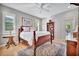 Inviting bedroom with hardwood floors, a ceiling fan, and plenty of natural light from the windows at 7235 Rangi Dr, Sarasota, FL 34241