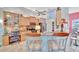 Open concept kitchen with island seating and views to the dining area at 7235 Rangi Dr, Sarasota, FL 34241