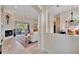 Inviting living room with a fireplace and sliding glass doors to the patio seating area at 7235 Rangi Dr, Sarasota, FL 34241