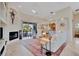 Bright living room with fireplace, tile flooring, and a seamless flow to the patio at 7235 Rangi Dr, Sarasota, FL 34241