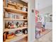 Walk-in pantry with organized shelving located off the dining area at 7235 Rangi Dr, Sarasota, FL 34241