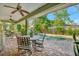 Covered patio with outdoor furniture overlooking a sparkling pool at 7235 Rangi Dr, Sarasota, FL 34241
