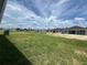 Vast green backyard, with a view of neighboring homes, offering an open and spacious feel at 766 Hillshire Pl, Spring Hill, FL 34609