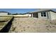 Spacious backyard with a view of the home's covered patio, ready for landscaping and outdoor enjoyment at 766 Hillshire Pl, Spring Hill, FL 34609