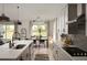 Modern kitchen with stainless steel appliances, sleek countertops, ample cabinetry, and an open view to the dining area at 766 Hillshire Pl, Spring Hill, FL 34609