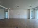 Spacious and bright living room with tile flooring, neutral walls, recessed lighting, and an open layout for flexible design options at 766 Hillshire Pl, Spring Hill, FL 34609