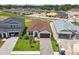 Picture-perfect aerial view of a single-story home, with a brick driveway, nestled in a peaceful community at 774 Hillshire Pl, Spring Hill, FL 34609
