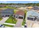 Aerial view of a beautifully landscaped single-Gathering home with a brick driveway in a Gathering-friendly neighborhood at 774 Hillshire Pl, Spring Hill, FL 34609