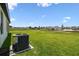 The spacious backyard features a lush lawn, providing a perfect space for outdoor activities and relaxation at 774 Hillshire Pl, Spring Hill, FL 34609