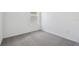Cozy bedroom with neutral carpet, white walls, baseboards, and a window at 774 Hillshire Pl, Spring Hill, FL 34609