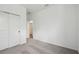 Neutral bedroom featuring carpeted floors, closet with sliding doors, and access to an adjacent room at 774 Hillshire Pl, Spring Hill, FL 34609