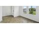 A flex space with wood-look herringbone floors and natural light at 774 Hillshire Pl, Spring Hill, FL 34609