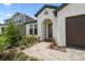 Close up of an attractive single Gathering home with brick driveway and lush, mature landscaping at 774 Hillshire Pl, Spring Hill, FL 34609