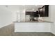 Bright kitchen features granite countertops, a gold faucet and stainless steel appliances at 774 Hillshire Pl, Spring Hill, FL 34609