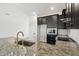 Bright kitchen features granite countertops, a gold faucet and stainless steel appliances at 774 Hillshire Pl, Spring Hill, FL 34609