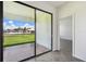Sliding glass doors opening to a patio and backyard at 774 Hillshire Pl, Spring Hill, FL 34609