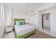 Bright bedroom with green accents and ample closet space at 800 N Tamiami Trl # 1111, Sarasota, FL 34236