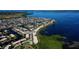 Aerial view of waterfront community with lush landscaping and private boat docks at 9612 Valencia Cv, Bradenton, FL 34210