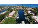Stunning aerial view of waterfront homes with private boat docks along a scenic canal, perfect for boating enthusiasts at 9612 Valencia Cv, Bradenton, FL 34210