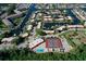 Aerial view featuring community tennis courts, shuffleboard, and community pool at 9612 Valencia Cv, Bradenton, FL 34210