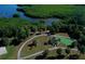Aerial view of community area with walking path, putting green and gazebo at 9612 Valencia Cv, Bradenton, FL 34210