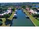 Aerial view of a home in a waterfront community featuring private boat lifts at 9612 Valencia Cv, Bradenton, FL 34210