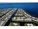 Expansive aerial shot of a waterfront community boasting picturesque canals and residences with private boat access at 9612 Valencia Cv, Bradenton, FL 34210