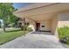 Exterior of home featuring a covered carport and well-maintained landscaping at 9612 Valencia Cv, Bradenton, FL 34210