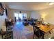 Living room with ample seating, workspace, and dining area at 9612 Valencia Cv, Bradenton, FL 34210