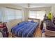 Cozy bedroom with a double bed and wood-look floors at 9612 Valencia Cv, Bradenton, FL 34210