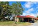 Single-story home with carport, landscaping, and a tranquil atmosphere at 9612 Valencia Cv, Bradenton, FL 34210