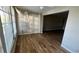 Open dining area with wood-look tile floors and access to living room at 9612 Valencia Cv, Bradenton, FL 34210