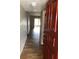 Entryway with wood-look tile flooring leading into the living area at 9612 Valencia Cv, Bradenton, FL 34210