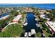 Aerial view of canal front community with boats and lush landscaping at 9612 Valencia Cv, Bradenton, FL 34210
