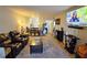 Living room with leather reclining sofas and a large TV at 9612 Valencia Cv, Bradenton, FL 34210