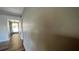 Hallway with wood-look tile floor and access to exterior at 9612 Valencia Cv, Bradenton, FL 34210