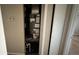 Small utility closet housing a modern furnace and plumbing, along with extra storage shelves at 9612 Valencia Cv, Bradenton, FL 34210