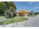 Cozy single-story home with carport and lush landscaping at 9612 Valencia Cv, Bradenton, FL 34210