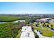 Aerial perspective of community amenities, including a pool, tennis courts, and lush greenery at 4013 Catalina Dr # 4013, Bradenton, FL 34210