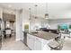Open kitchen features granite island, stainless steel appliances, and breakfast bar at 4013 Catalina Dr # 4013, Bradenton, FL 34210