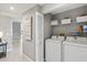 Convenient laundry room with washer, dryer, and storage shelves at 4013 Catalina Dr # 4013, Bradenton, FL 34210