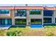 Townhouse with a balcony, showcasing sliding glass doors and a patio area at 4013 Catalina Dr # 4013, Bradenton, FL 34210