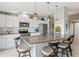 Modern kitchen with white cabinets, granite countertops and stainless steel appliances at 4013 Catalina Dr # 4013, Bradenton, FL 34210
