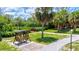 Relaxing waterfront view with a wooden swing and walking paths at 4013 Catalina Dr # 4013, Bradenton, FL 34210