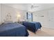 Twin bedroom with nautical decor and window view at 4013 Catalina Dr # 4013, Bradenton, FL 34210