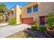 Tan colored condo building with red garage door at 4013 Catalina Dr # 4013, Bradenton, FL 34210
