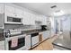 Modern community kitchen with white cabinetry and granite counters at 4013 Catalina Dr # 4013, Bradenton, FL 34210
