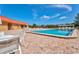 Community pool area with patio furniture at 4013 Catalina Dr # 4013, Bradenton, FL 34210